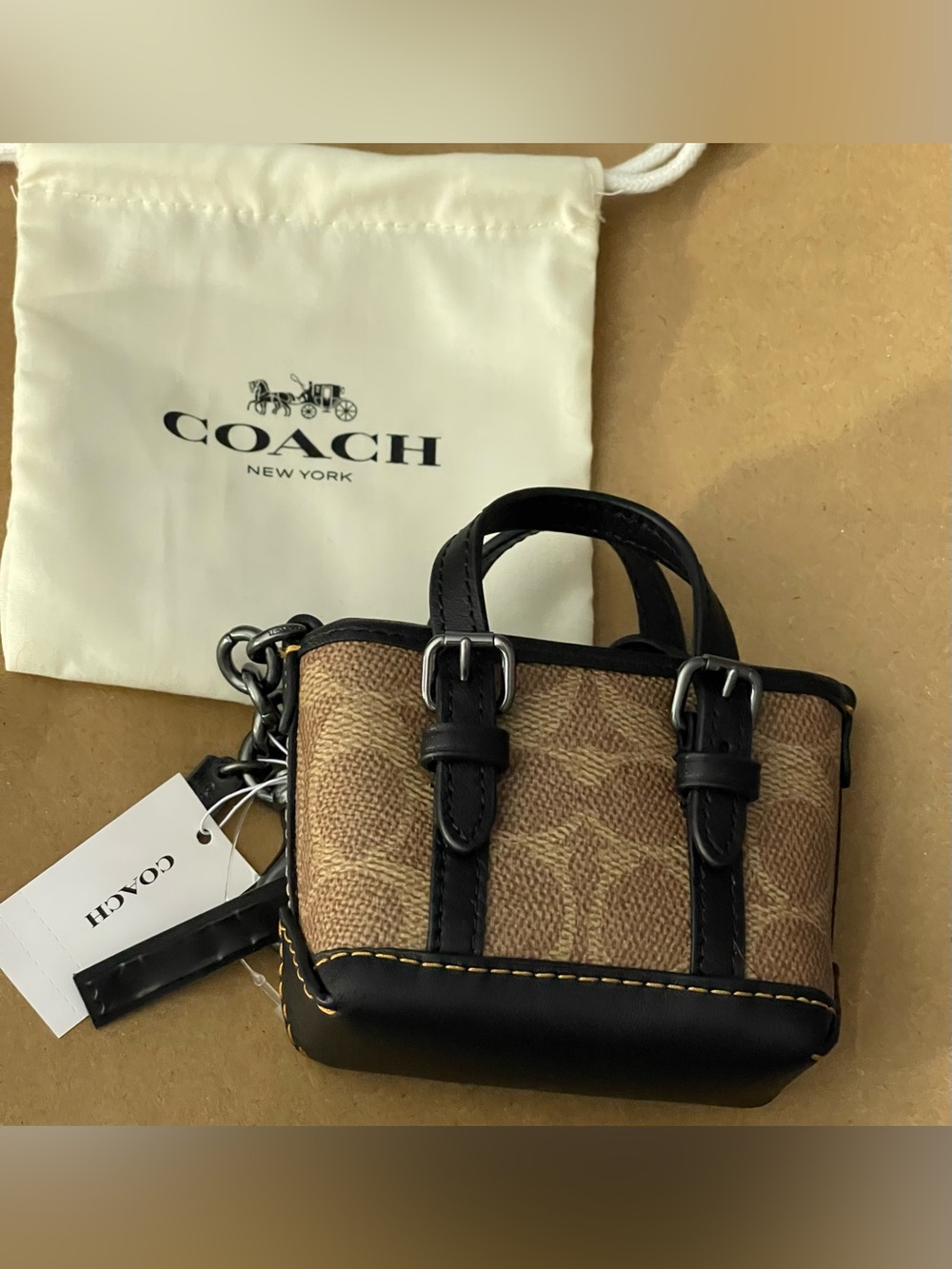 Coach mini bag , bag charm monogrammed, brown and tan